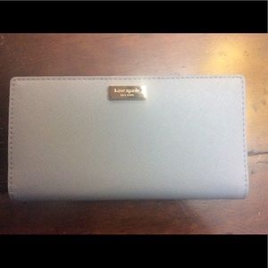 Kate Spade Wallet-NWT, Retail is $120.
